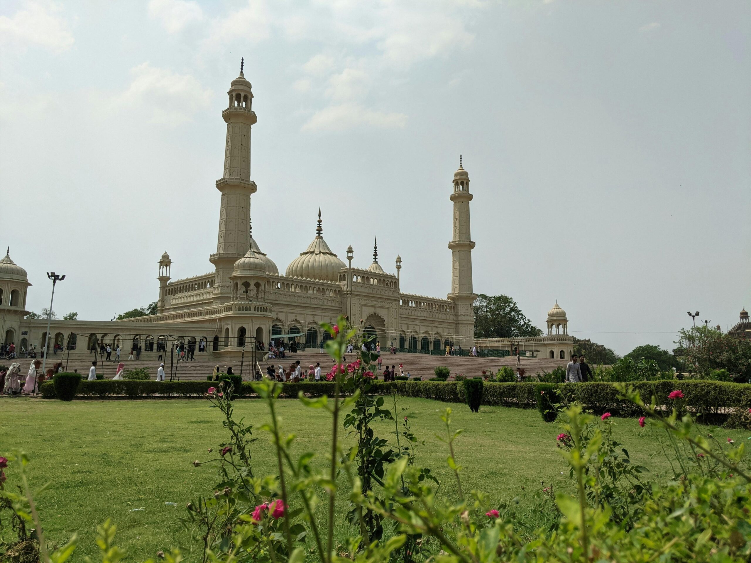 Stunning view of Bara Imambara and gardens in Lucknow, India under a bright sky.